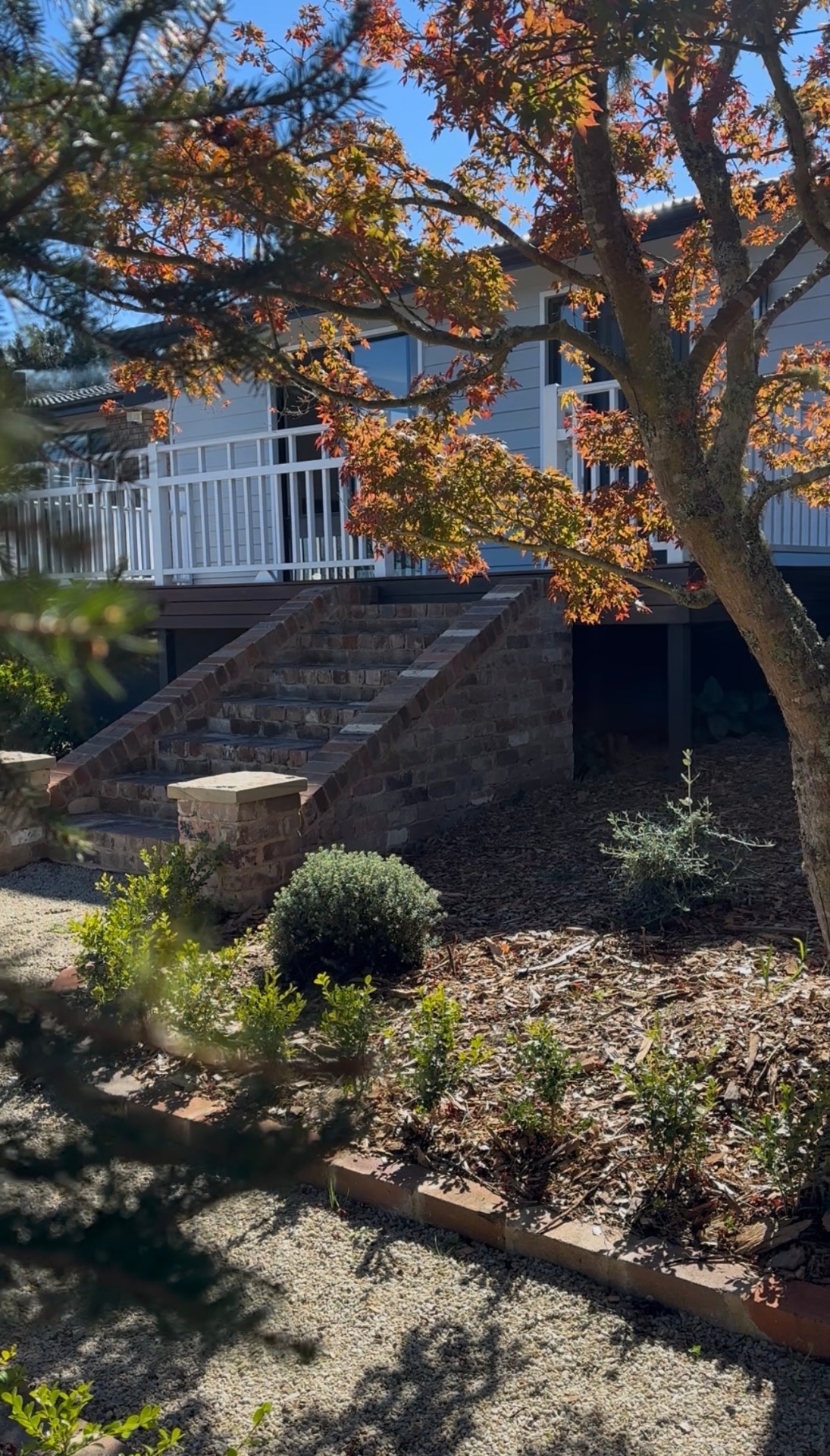 La Villa Dolce stone cottage at golden hour over the Blue Mountains escarpment